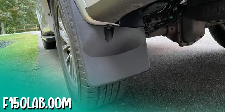 A Ford F150 with custom mud flaps installed